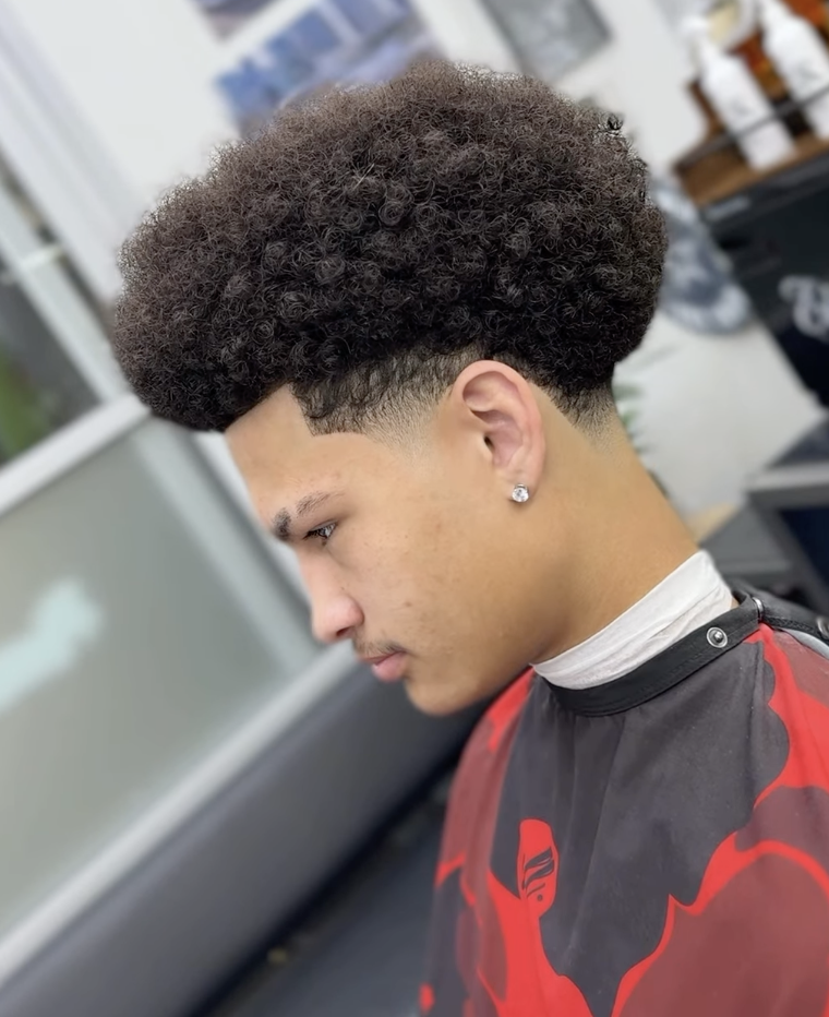 Curly top with low taper fade